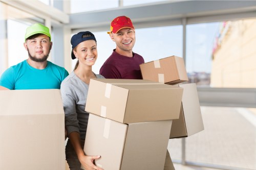 A moving team preparing items safely beside a van