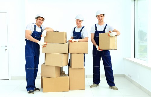 Moving team wearing PPE and handling items carefully