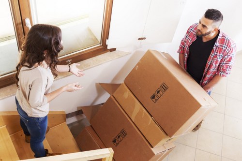 Moving day preparation with packed boxes and furniture in Tooting