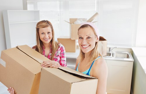 Packed business equipment ready for a commercial move in South London